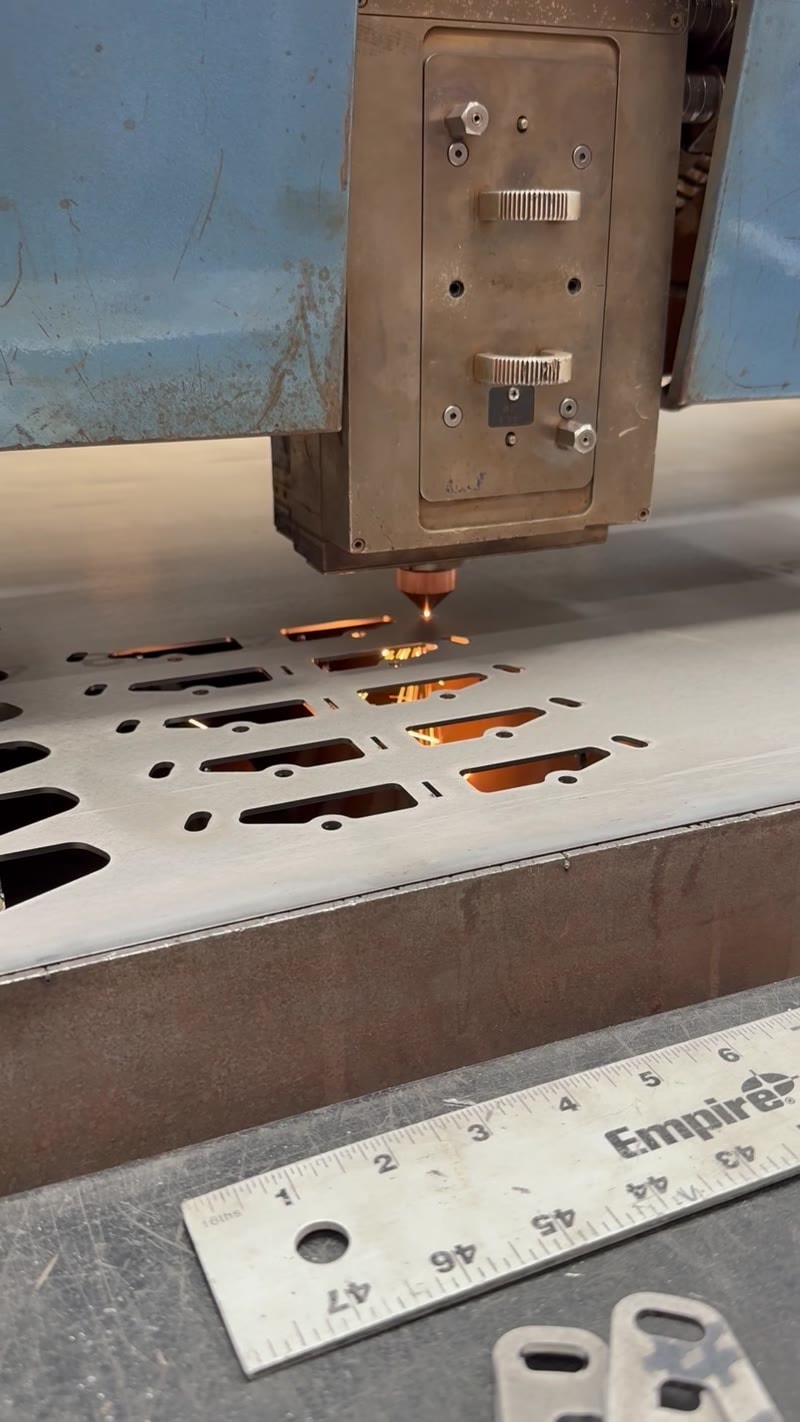 Laser cutting close-up with ruler for scale